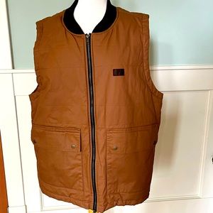 Men’s KAVU utility vest with plaid lining.